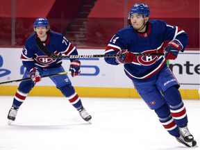 Montreal Canadiens centre Nick Suzuki, right, reacts to a change in play as Montreal Canadiens right wing Tyler Toffoli looks on during NHL action against the Winnipeg Jets in Montreal on March 4, 2021.