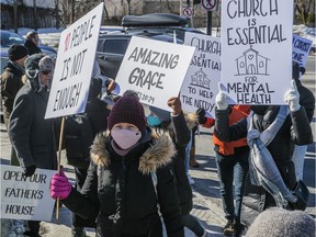 Demonstrators walk along Côte-des-Neiges Rd. on Sunday March 7, 2021 to demand that the government ease restrictions on houses of worship during the COVID-19 pandemic.