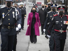 Montreal Mayor Valérie Plante is flanked by an honour guard as she arrives for the ceremony to mark the one-year anniversary of the COVID-19 pandemic, on Thursday March 11, 2021.
