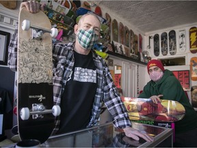 Paget Williams, left,  and Orion Revolution Curiel, owners of the Revolution 514 skateboard shop outside their store on Friday, March 12, 2021, during the COVID-19 pandemic. They are selling special limited release T-Shirts, that Williams wears proudly, to help pay their winter rent.
