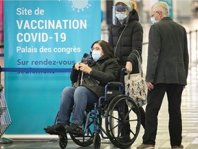 People wait for their turn at the COVID-19 vaccination site at the Palais de congrès in Montreal March 15, 2021.