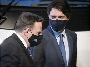 Prime Minister Justin Trudeau, left and Quebec Premier François Legault after making announcement on a combined $100-million investment in Lion Electric on Monday March 15, 2021.