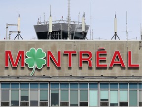 A shamrock replaces the O on the sign atop the terminal at Montréal–Trudeau International Airport in Montreal on March 16, 2021 the day before St. Patrick's Day.