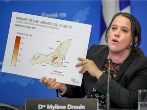 Montreal public health director Dr. Mylène Drouin displays a graphic showing the number of COVID-19 variants by neighbourhood at a press conference on March 17, 2021.