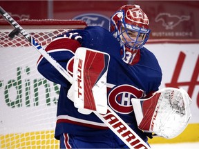 Canadiens goalie Carey Price makes save during Saturday night’s game against the Vancouver Canucks at the Bell Centre.