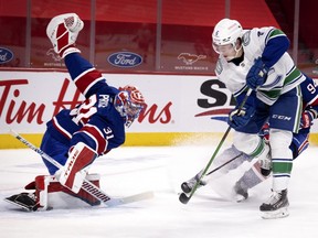 Canadiens goaltender Carey Price makes a big save against Canucks' Brock Boeser in overtime last week.