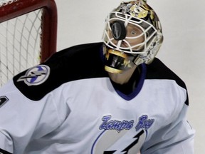Goalie Sean Burke, while playing for the Tampa Bay Lightning against the Canadiens during a game at the Bell Centre in 2005, keeps his eye on the puck.