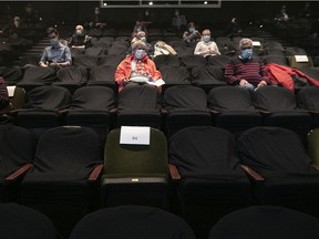 Spectators sit in their socially distanced seats at the Centaur Theatre for the opening of the season at the Centaur Theatre on Friday, March 26, 2021, during the COVID-19 pandemic. The theatre limits the seating capacity to 36 for the play Mob.