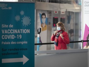 A woman arrives at the  Palais des Congrès vaccination centre on Monday March 29, 2021.