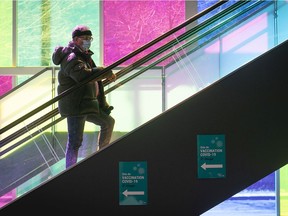 A man makes his way up to the Palais des congrés vaccination centre on Monday, March 29, 2021.