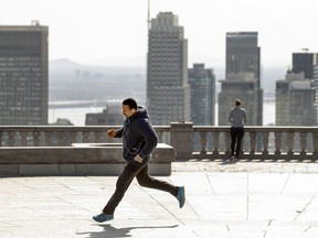 Nacim Louali does a short sprint while working out at the look-out on Mount Royal in Montreal Tuesday, March 30, 2021.