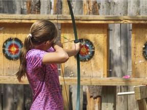 A girl takes aim at a target on the archery range at St-Lazare's day camp at the Centre de Plein Air et Forrestiers de St-Lazare in 2015. St-Lazare is holding a day camp information session on Tuesday, April 6, 2021 at 7 p.m. Online registration is required to participate.
