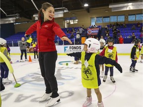 Ice dancer Laurence Fournier Beaudry skates with Audrina Guerrera as she joined fellow Skate Canada National Team members skating with kids in the Town of Mount Royal Figure Skating Club in September  2019.