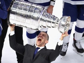 General Manager Julien BriseBois of the Tampa Bay Lightning poses with the Stanley Cup on Sept. 28, 2020 in Edmonton.