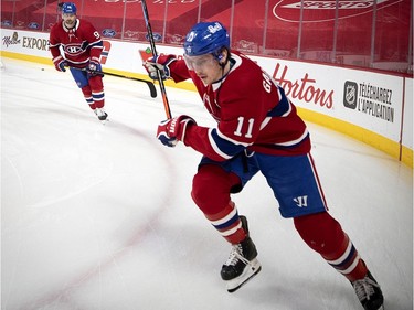Canadiens' Brendan Gallagher (11) and Tomas Tatar (90), rear, take part in the pregame skate during NHL action against the Winnipeg Jets in Montreal on Saturday, March 6, 2021.