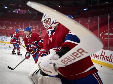 Canadiens goaltender Jake Allen and Montreal's Tyler Toffoli (73) take part in the pregame skate during NHL action against the Winnipeg Jets in Montreal on Saturday, March 6, 2021.