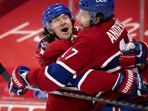 Canadiens' Tyler Toffoli (73) celebrates with Josh Anderson (17) after scoring against the Winnipeg Jets during NHL action in Montreal on Saturday, March 6, 2021.