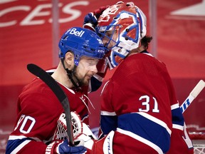 Montreal Canadiens left wing Tomas Tatar (90) congratulates Montreal Canadiens goaltender Carey Price (31) after beating the Winnipeg Jets 7-1, during NHL action in Montreal on Saturday, March 6, 2021.  (Allen McInnis / MONTREAL GAZETTE) ORG XMIT: 65846