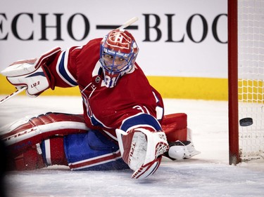 Canadiens goaltender Carey Price watches as Winnipeg Jets' Mathieu Perreault (85) scores during a power play during NHL action in Montreal on Saturday, March 6, 2021. The Canadiens won the game 7-1.