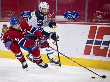 Canadiens defenceman Shea Weber (6) takes the puck from Winnipeg Jets' Blake Wheeler (26) during NHL action in Montreal on Saturday, March 6, 2021.