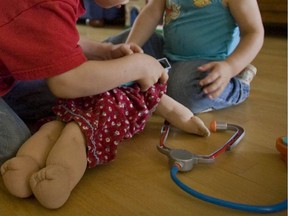 Toddlers playing doctor appear to check a doll's ears at their Montreal-area home in 2008. This photo was taken to accompany a news story about the importance of screening newborns for hearing loss and the advocacy underway at that time to persuade the province to establish such a program. "In Quebec, just 30 per cent of babies are currently screened, despite a 'universal' screening program having been announced by the provincial government back in 2009," Mary-Jane Blais writes.