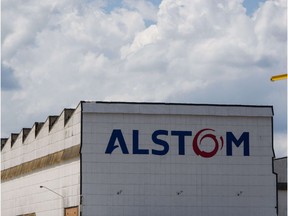 This combination of file pictures made on April 24, 2014 shows a view taken on October 29, 2009 of the logo (L) of GE Energy (General Electric), a world's leading suppliers of power generation and energy delivery technologies, in Belfort, eastern France and a view taken on March 8, 2012 of Alstom's largest hydropower manufacturing plant (R) in the world in Taubate, about 130km east of Sao Paulo. Europe's main stock markets rose at the start of trading on April 24, with London's benchmark FTSE 100 index up 0.37 percent to 6,699.37 points. French industrial giant Alstom was the star performer, surging initially by 17 percent on reports that it could be bought by US titan General Electric.  AFP PHOTO / SEBASTIEN BOZON / YASUYOSHI CHIBASEBASTIEN BOZON,YASUYOSHI CHIBA/AFP/Getty Images ORG XMIT: -