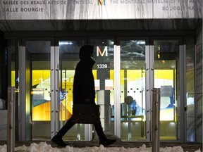 A man walks past the Montreal Museum of Fine Arts after curfew in Montreal, on Thursday, March 4, 2021.