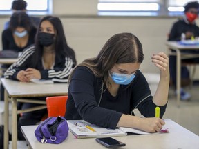 Masked students in French class at John F. Kennedy High School in Montreal Tuesday November 10, 2020. Students in Secondary 3, 4 and 5 are to be back in school full time as of Monday.