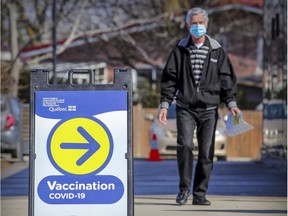 A man heads to the COVID-19 vaccination centre at the Gerry-Roberson Community Centre in Pierrefonds on March 25.