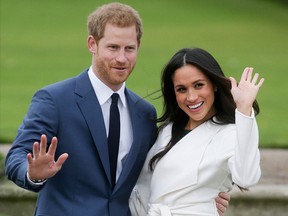 Prince Harry and Meghan Markle pose for a photograph in the Sunken Garden at Kensington Palace Nov. 27, 2017.