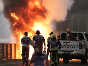 Flames engulf Romain Grosjean’s car after he crashed at the start of the Bahrain Grand Prix on Nov. 29, 2020.
