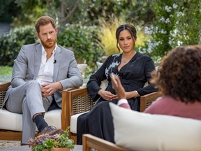 FILE PHOTO: Britain's Prince Harry and Meghan, Duchess of Sussex, are interviewed by Oprah Winfrey in this undated handout photo.  Harpo Productions/Joe Pugliese/Handout via REUTERS/File Photo ORG XMIT: FW1 ORG XMIT: POS2103071928199134