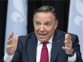 Quebec Premier Francois Legault, responds to reporters questions during a news conference on the COVID-19 pandemic, Tuesday, March 23, 2021 at the legislature in Quebec City.
