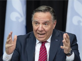Quebec Premier François Legault responds to reporters' questions during a news conference on the COVID-19 pandemic, Tuesday, March 23, 2021 at the legislature in Quebec City.