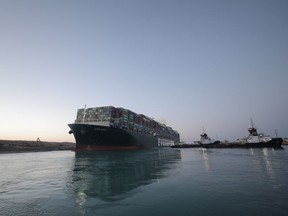 A view shows the container ship Ever Given, one of the world's largest container ships, after it was partially refloated, in Suez Canal, Egypt March 29, 2021.