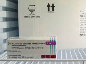 A box of AstraZeneca COVID-19 vaccine is seen in a fridge amid a vaccination campaign in Ronquieres, Belgium March 15, 2021. REUTERS/Yves Herman