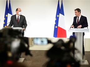 French Prime Minister Jean Castex and French Health Minister Olivier Veran deliver a news conference on the current French government strategy for the ongoing COVID-19 pandemic, in Paris, France March 18, 2021. Martin Bureau/Pool via REUTERS