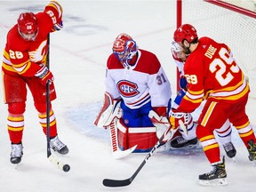 Canadiens goaltender Carey Price guards his net as Flames' Elias Lindholm (28) tries to score during the second period at Scotiabank Saddledome in Calgary on Saturday, March 13, 2021.