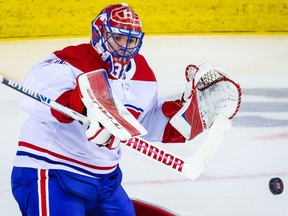 Canadiens goaltender Carey Price makes a save against the Flames during the first period at Scotiabank Saddledome in Calgary on Saturday, March 13, 2021.