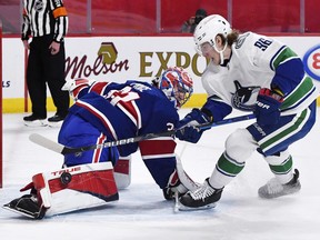 Montreal Canadiens goalie Carey Price stops Vancouver Canucks forward Adam Gaudette during the shootout period at the Bell Centre on March 20, 2021, in Montreal.