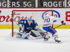 Mar 8, 2021; Vancouver, British Columbia, CAN; Vancouver Canucks goalie Thatcher Demko (35) makes a save on Montreal Canadiens forward Tomas Tatar (90) in the overtime shootout at Rogers Arena. Canucks won 2-1 in an overtime shootout. Mandatory Credit: Bob Frid-USA TODAY Sports