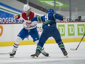 Vancouver Canucks' forward J.T. Miller (9) fights with Montreal Canadiens' defenceman Ben Chiarot (8) in the first period at Rogers Arena March 10, 2021.