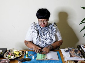 Ika Vantianti, an Indonesian artist, prepares a handmade journal before mentoring an online creative journaling workshop for women, as part of an event to celebrate International Women's Day, in Jakarta, Indonesia, March 3, 2021.