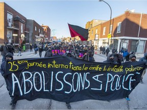 Protesters take part in the annual anti-police brutality demonstration in Montreal, Monday, March 15, 2021.