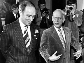 Photographers focus their cameras on Prime Minister Pierre Trudeau (left) and Quebec Premier René Lévesque in Ottawa on Jan. 4, 1979.