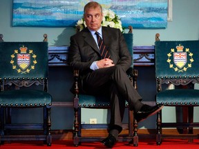 Prince Andrew, the Duke of York, waits to present The Duke Edinburgh's Gold Award to recipients during a ceremony at the Government House Saturday May 18, 2013 in Victoria.