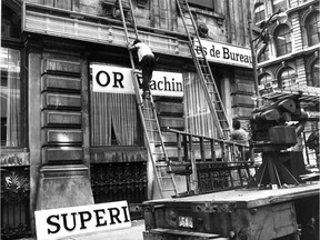 Frank Phillipp and Michel Delorme install new French signs for Superior Business Machines Ltd -- reading Superior Machines de Bureau Ltée. -- at the company's office on Ste-Hélène St. on June 29, 1978, just ahead of the deadline that July 3 to conform to the provisions of Bill 101. It's "perfectly reasonable that in a majority francophone province, signage must allow French to predominate," Peter G. White writes.