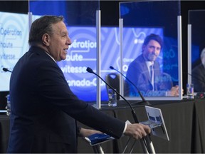 Quebec Premier François Legault jointly announces high-speed internet for Quebec regions, as Prime Minister Justin Trudeau, right, looks on, Monday, March 22, 2021 in Trois-Rivières.