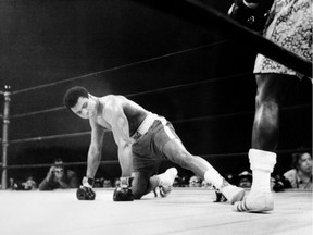A picture taken March 8, 197,1 in New York at the Madison Square Garden of the heavyweight boxing world championship fight between Muhammad Ali (Cassius Clay) (on the floor) and Joe Fazier at the end of which Frazier kept his title of heavyweight boxing world champion.
