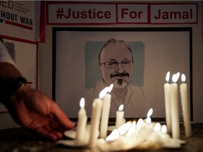 FILE PHOTO: The Committee to Protect Journalists and other press freedom activists hold a candlelight vigil in front of the Saudi Embassy to mark the anniversary of the killing of journalist Jamal Khashoggi at the kingdom's consulate in Istanbul, Wednesday evening in Washington, U.S., October 2, 2019. REUTERS/Sarah Silbiger/File Photo
